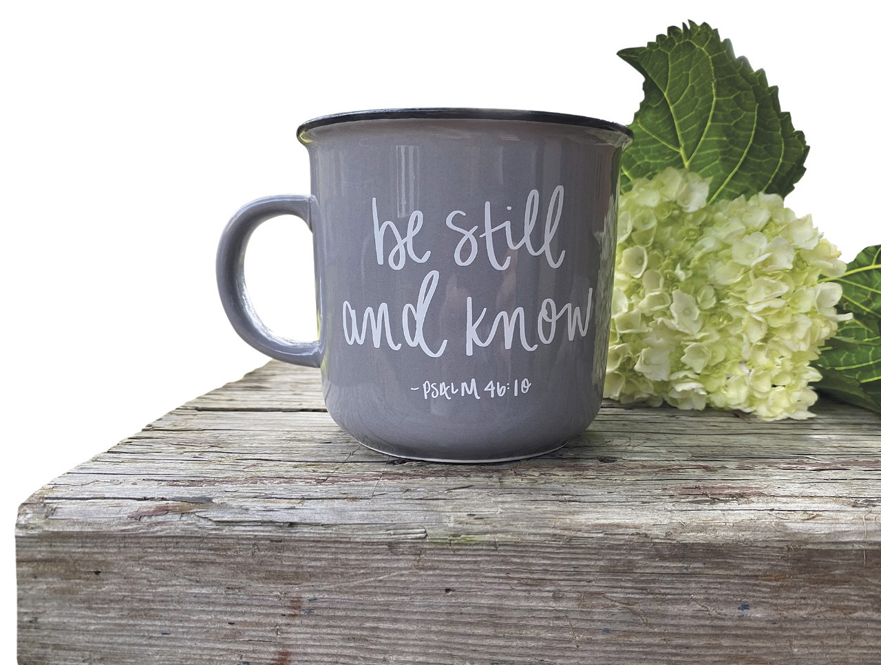 a mug with the Bible quote be still and know
