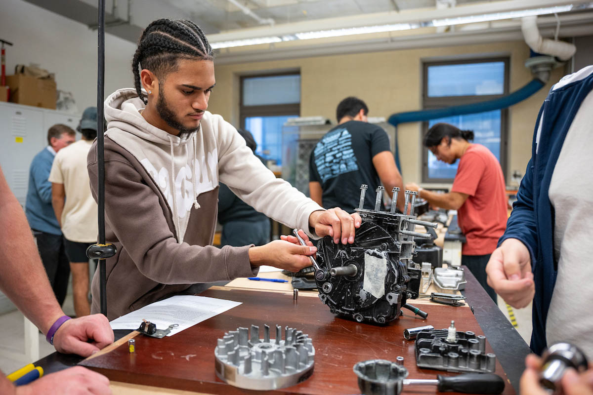 A student tinkering with technology