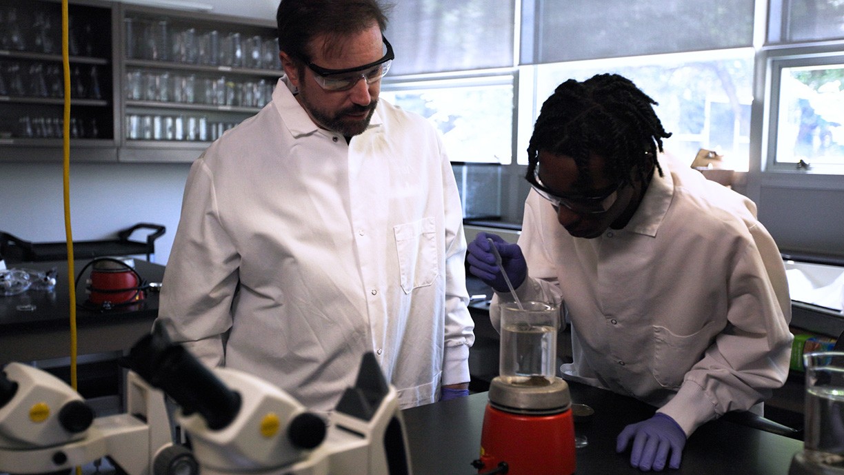 Dr. Goldsmith mentors a student from Saul High School in his lab.