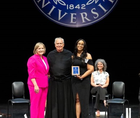 3 people on stage: From left: Christine Kelleher Palus, PhD, Dean, College of Professional Studies; Villanova University President Peter M. Donohue, OSA, PhD; Tracey Barnes.