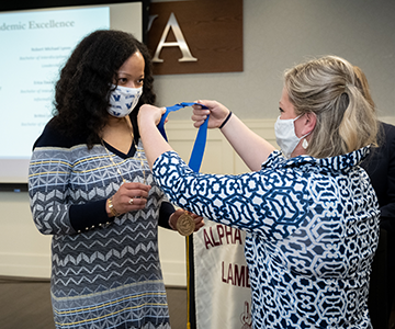 Erica Howard receives a medal