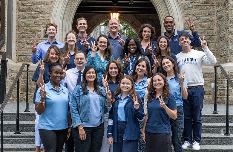 Admission staff giving "vs up"